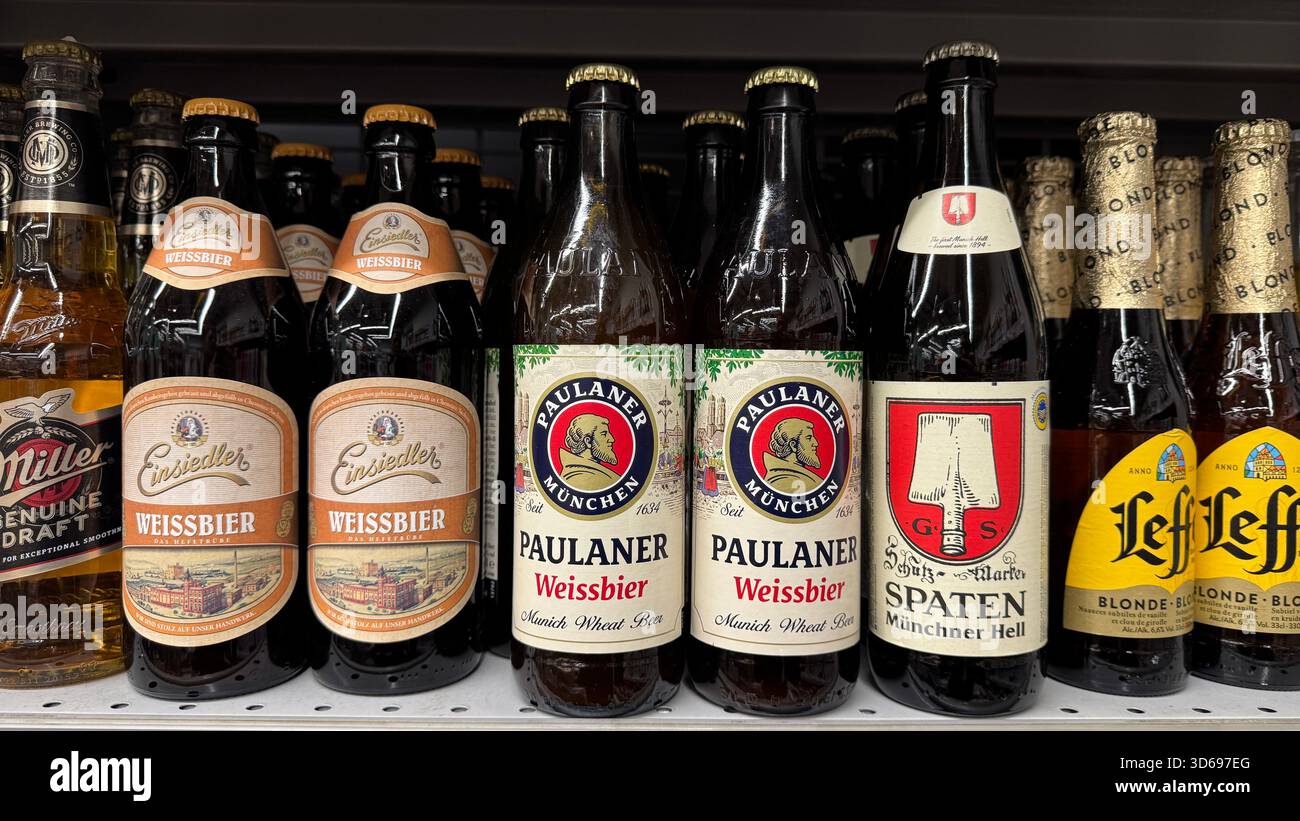Bottles of Beer on Display in a Retail Store Showcasing Different Brands and Types Stock Photo