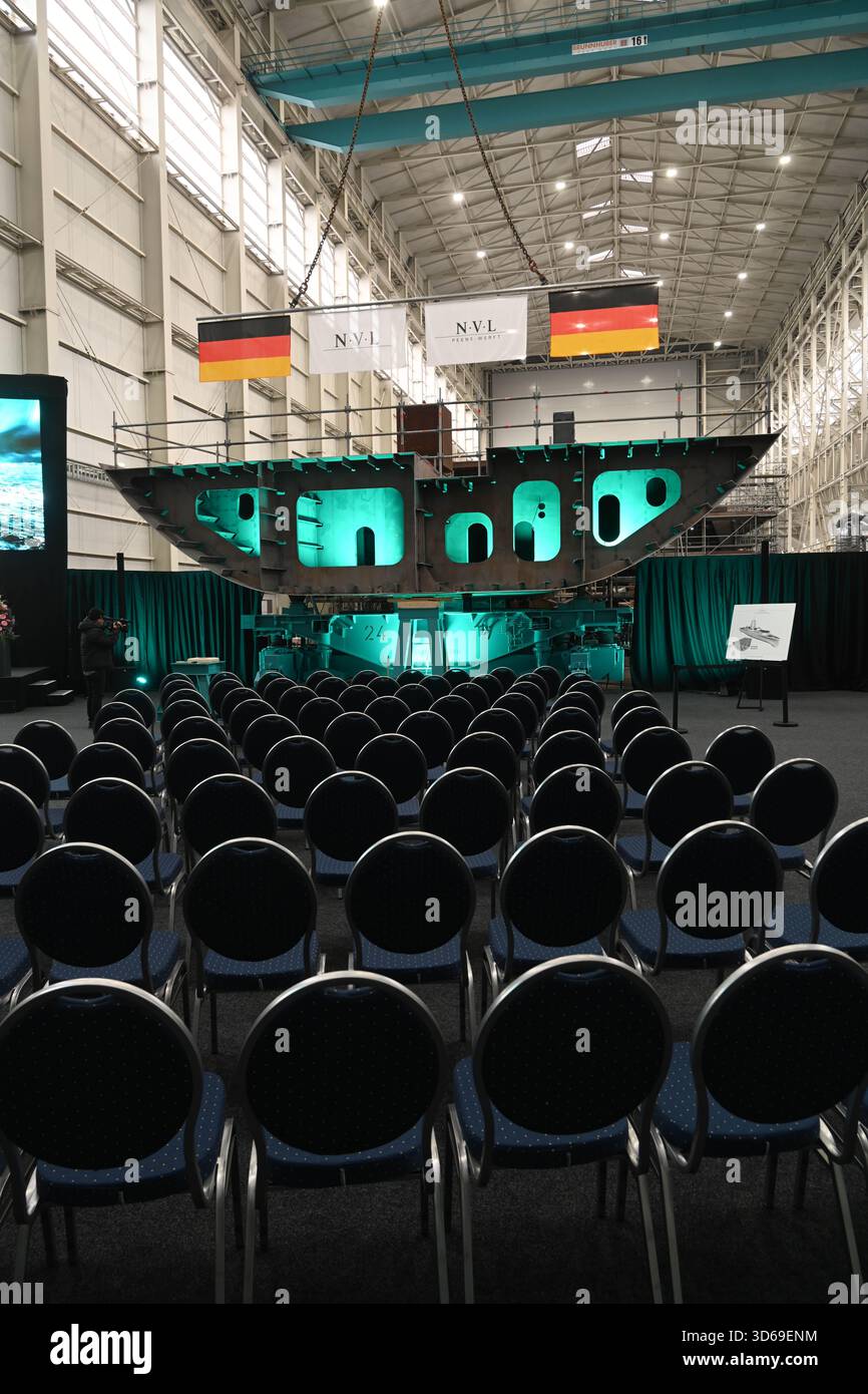 Wolgast, Germany. 19th Nov, 2025. Keel laying of the second fleet service boat in the shipyard hall of the Peene shipyard. The contract for the construction was awarded to the Bremen-based Naval Vessels Lürssen Group (NVL). Work on the ships is to be carried out at several shipyards in northern Germany. Credit: Stefan Sauer/dpa/Alamy Live News Stock Photo