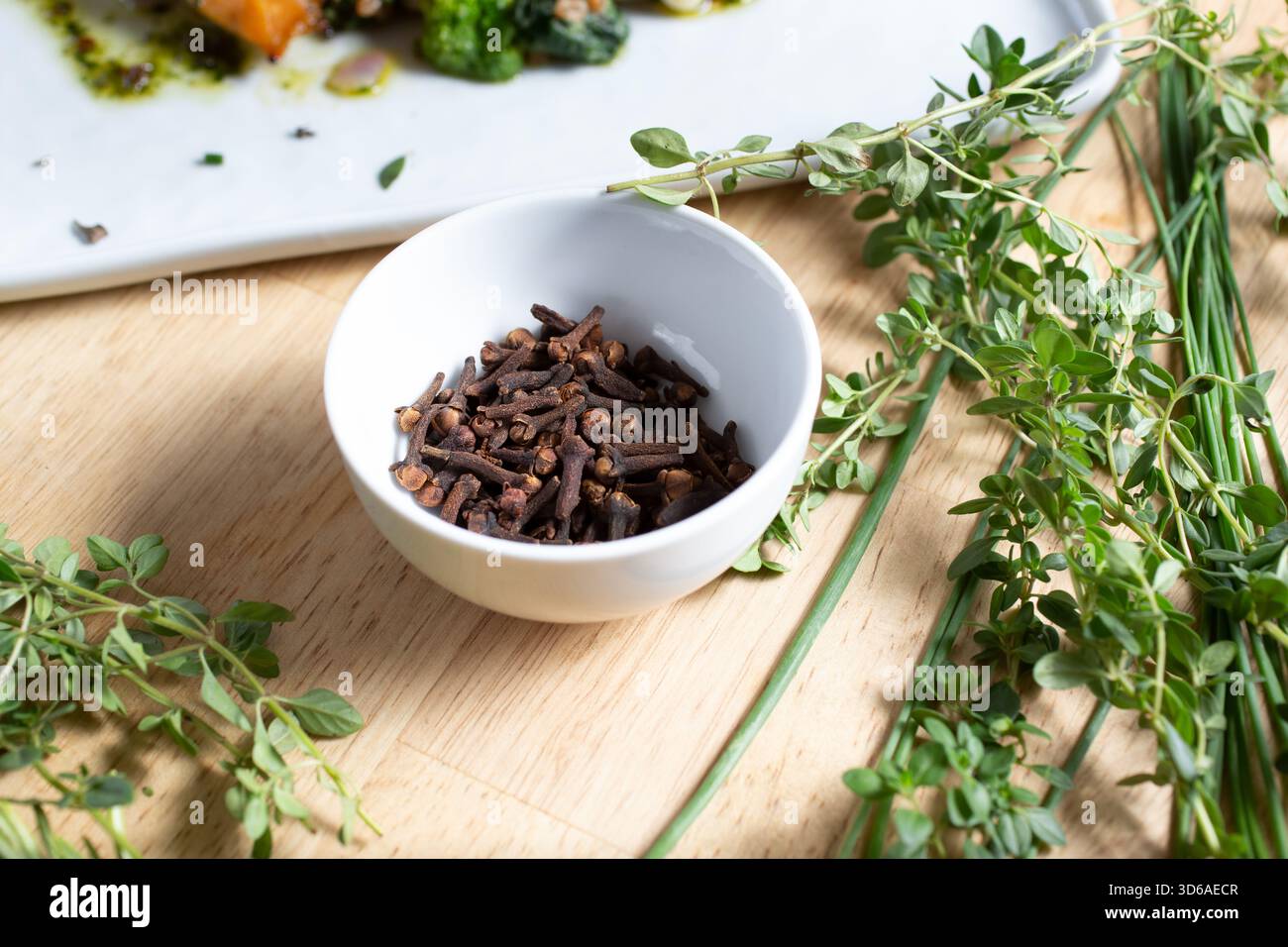 A view of a condiment cup of cloves. Stock Photo