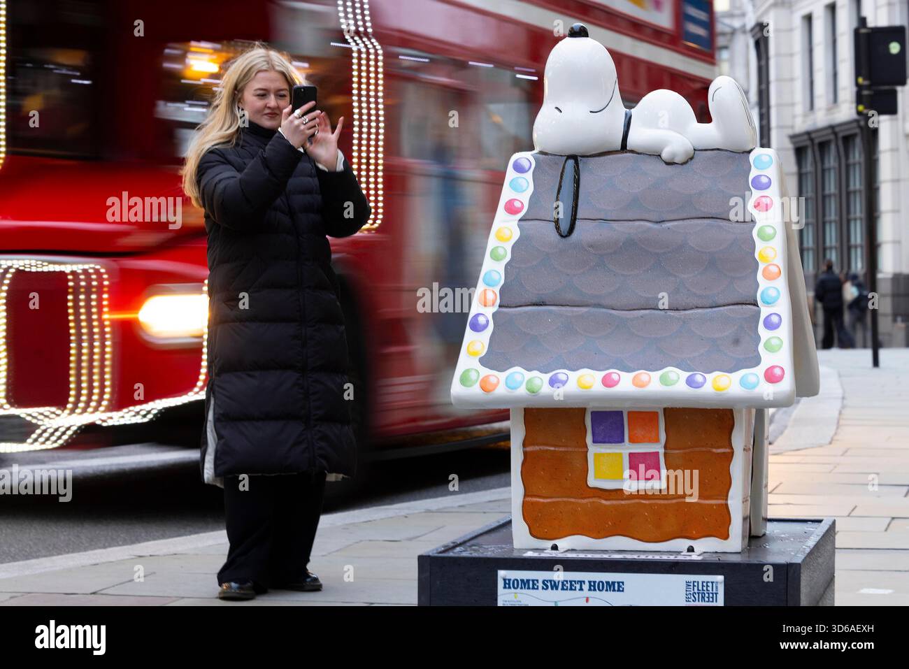 EDITORIAL USE ONLY 'Snoopy in the City' Sculpture Trail, part of the Christmas celebrations in Fleet Street Quarter, marking the launch of the area's partnership with the National Literacy Trust and debut of it's 'Snoopy in the City' Sculpture Trail as part of Peanuts' 75th anniversary, London. Issue date: Wednesday 19 November, 2025. Stock Photo