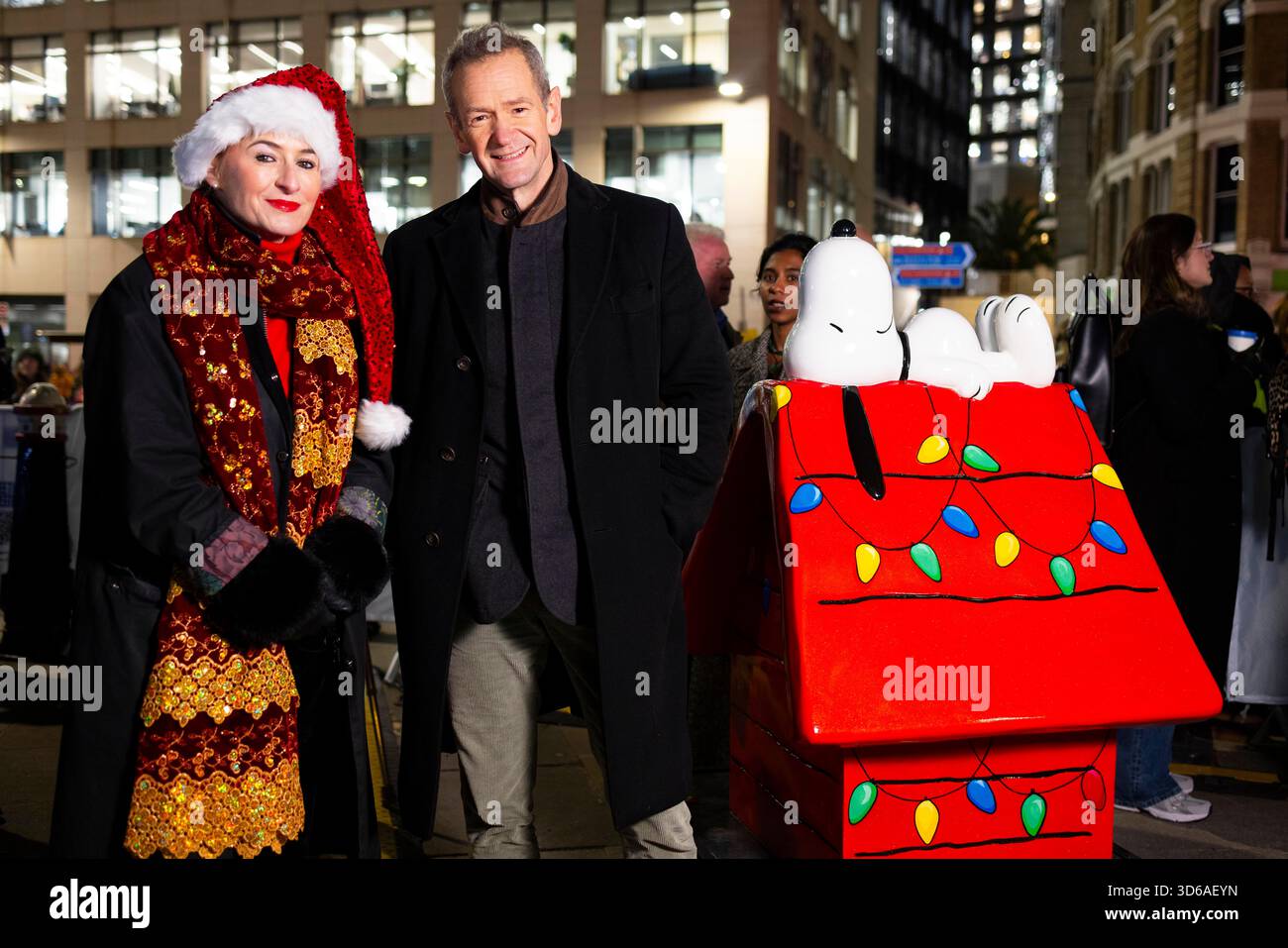 EDITORIAL USE ONLY Alexander Armstrong and Lady Lucy French, chief executive of Fleet Street Quarter Bid kick starts the Christmas celebrations in Fleet Street Quarter, marking the launch of the area's partnership with the National Literacy Trust and debut of it's 'Snoopy in the City' Sculpture Trail as part of Peanuts' 75th anniversary, London. Issue date: Wednesday 19 November, 2025. Stock Photo