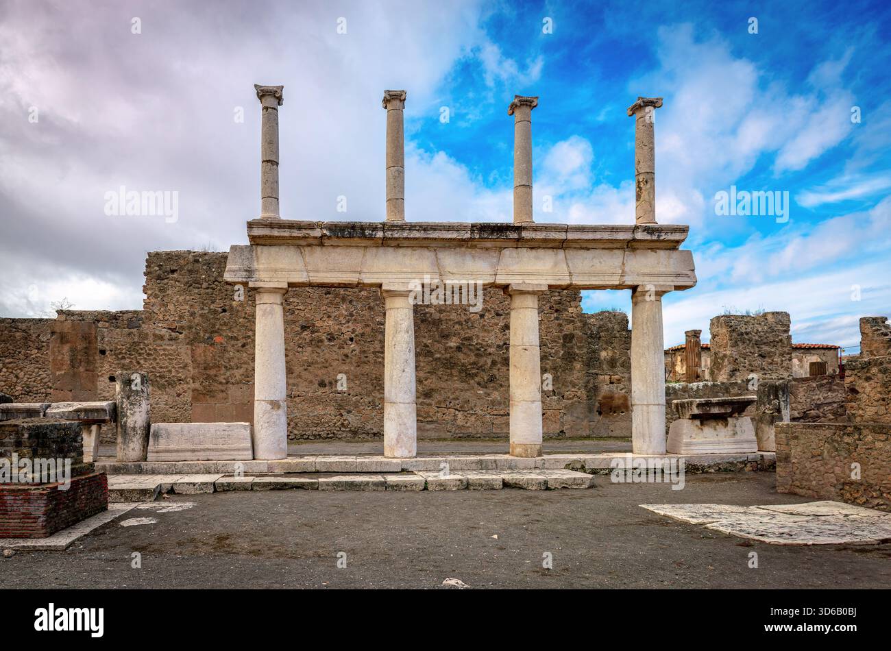 Doric and Corinthian columns of the colonnade in the Roman Forum of Pompeii, looking south-west. Archaeologic Park of Pompeii, in the Campania Region. Stock Photo