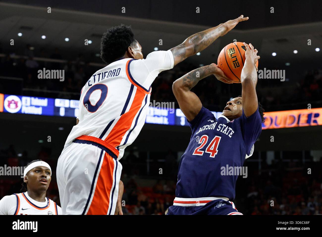 Jackson State guard Daeshun Ruffin (24) puts up a shot as Auburn guard ...