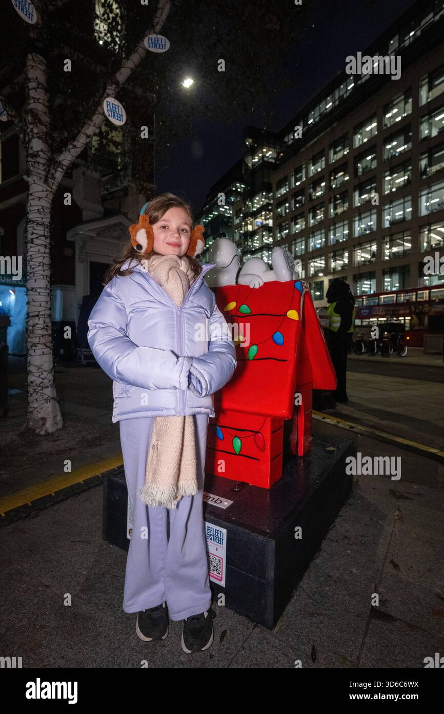 London, UK, 19th November 2025, Christmas Lights were switched on in Fleet Street by Alexander Armstrong, Snoopy and  Lady Lucy French on the 19th November. It marks the start of Festive Fleet Street Quarter 2025 programme which includes a Snoopy sculpture trail. Featuring 12 artist-designed Snoopy sculptures displayed across the Quarter, this runs until 16th January 2026., Andrew Lalchan Photography/Alamy Live News Stock Photo