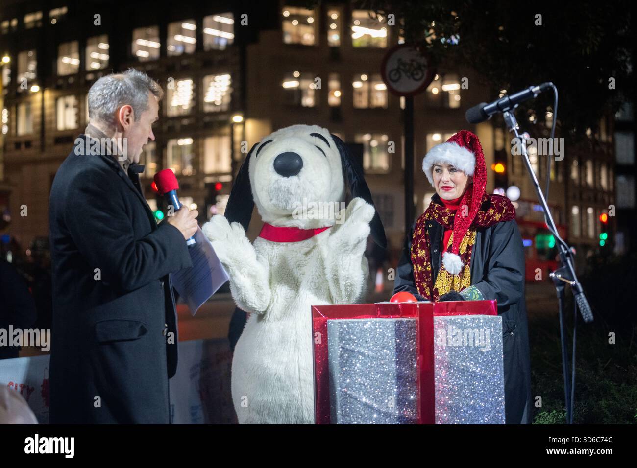 London, UK, 19th November 2025, Christmas Lights were switched on in Fleet Street by Alexander Armstrong, Snoopy and  Lady Lucy French on the 19th November. It marks the start of Festive Fleet Street Quarter 2025 programme which includes a Snoopy sculpture trail. Featuring 12 artist-designed Snoopy sculptures displayed across the Quarter, this runs until 16th January 2026., Andrew Lalchan Photography/Alamy Live News Stock Photo