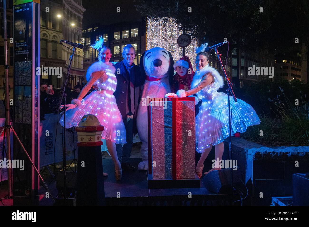 London, UK, 19th November 2025, Christmas Lights were switched on in Fleet Street by Alexander Armstrong, Snoopy and  Lady Lucy French on the 19th November. It marks the start of Festive Fleet Street Quarter 2025 programme which includes a Snoopy sculpture trail. Featuring 12 artist-designed Snoopy sculptures displayed across the Quarter, this runs until 16th January 2026., Andrew Lalchan Photography/Alamy Live News Stock Photo