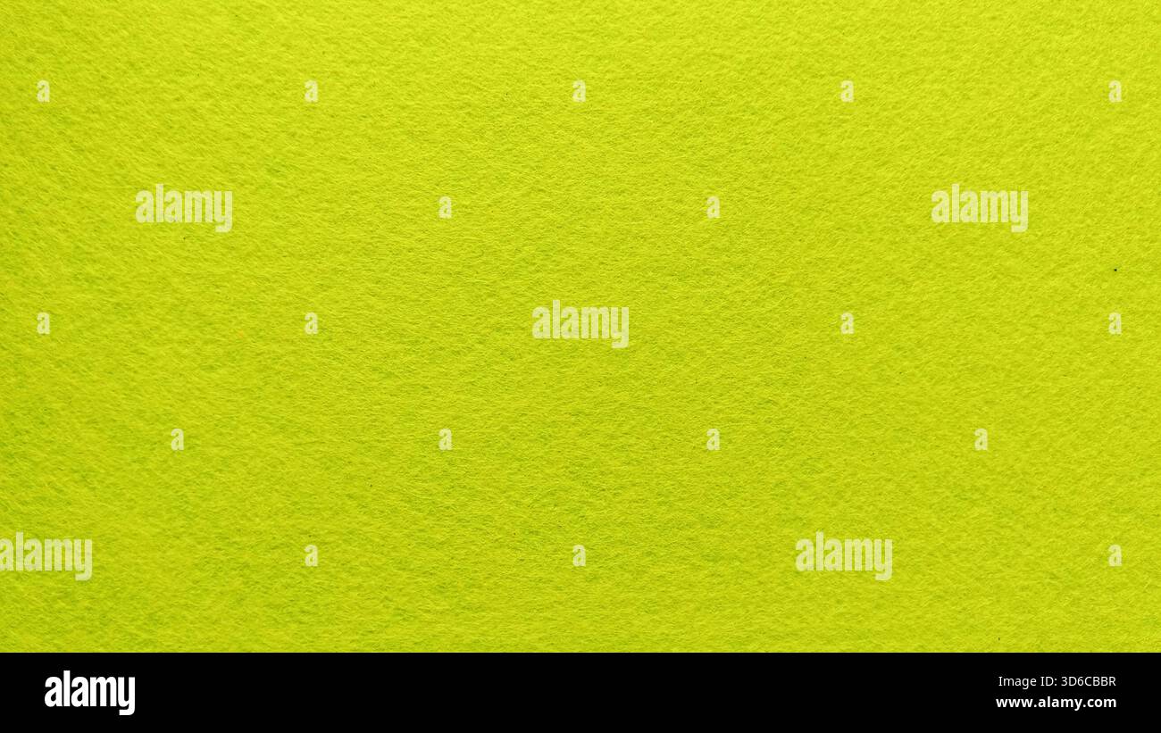 Bright Lime Green Felt Fabric Material Texture Background Displaying Rough Surface and Full Frame Copy Space Stock Photo