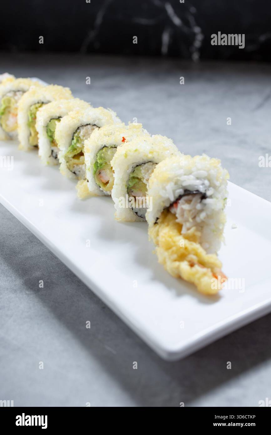 A view of a crunchy sushi roll. Stock Photo