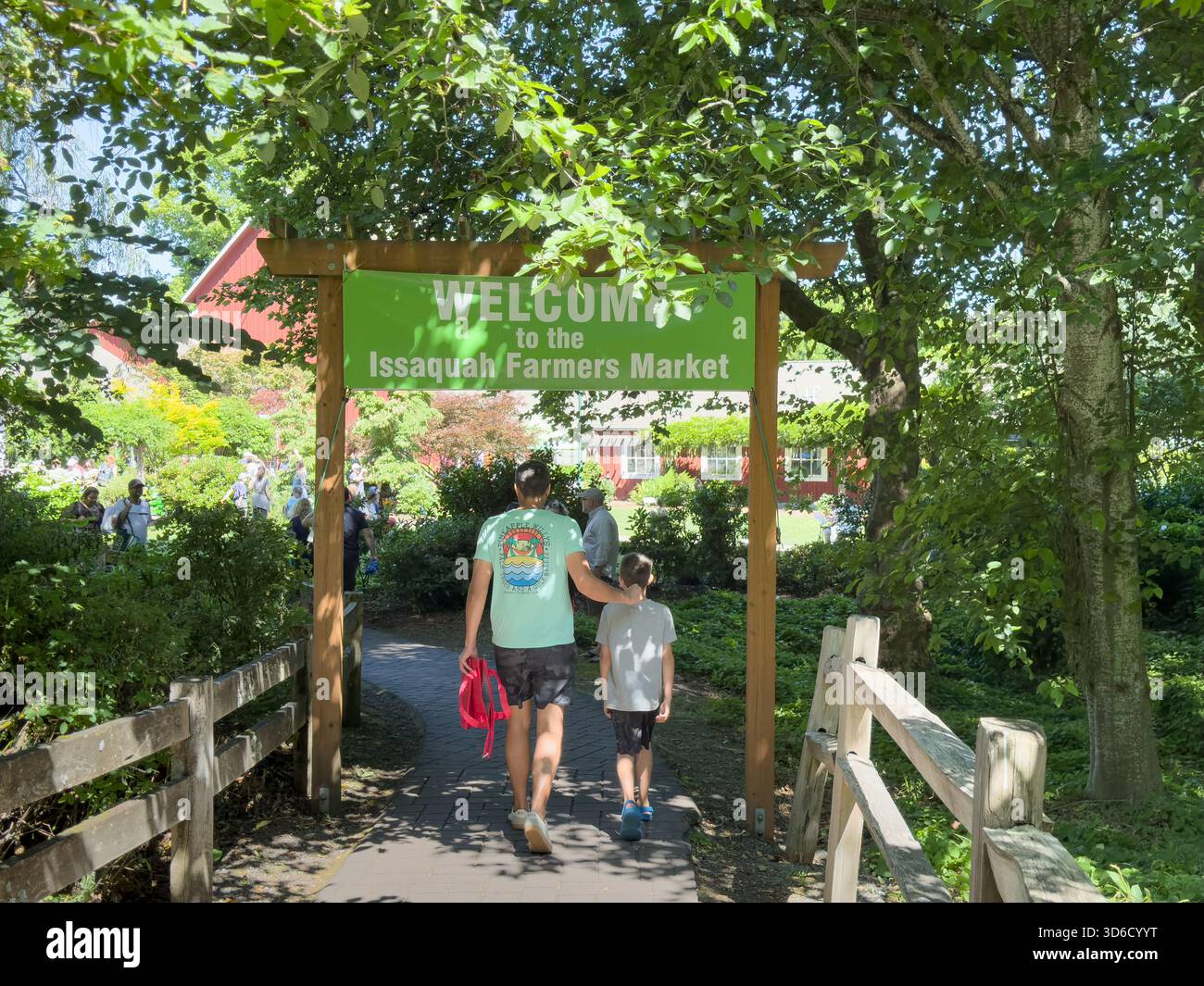 Issaquah, Washington, United States - 07-01-2023: A view of people at the entrance to the Issaquah Farmers Market. Stock Photo