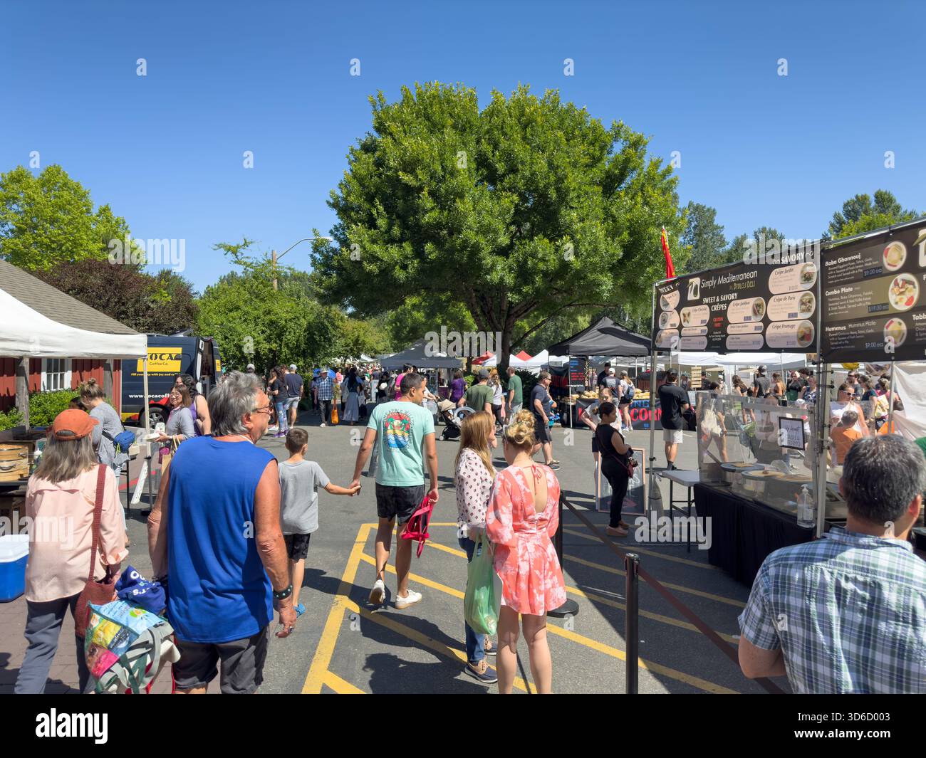 Issaquah, Washington, United States - 07-01-2023: A view of people walking around the Issaquah Farmers Market. Stock Photo