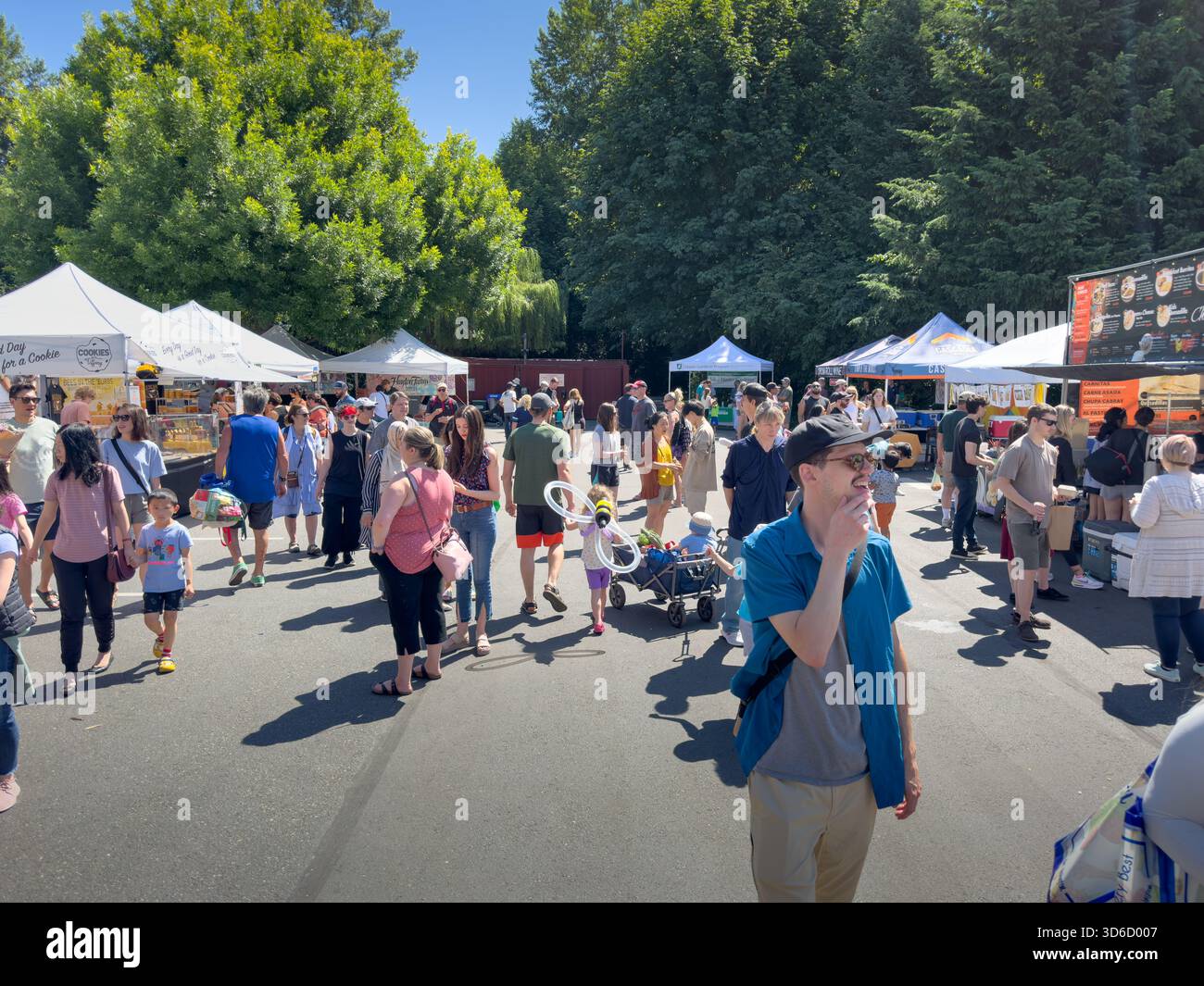 Issaquah, Washington, United States - 07-01-2023: A view of people walking around the Issaquah Farmers Market. Stock Photo