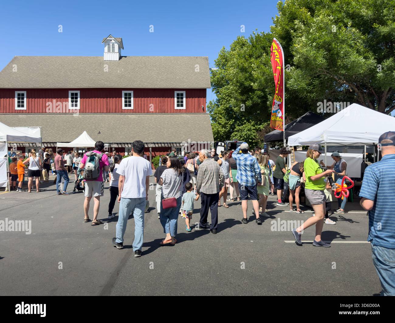 Issaquah, Washington, United States - 07-01-2023: A view of people walking around the Issaquah Farmers Market. Stock Photo