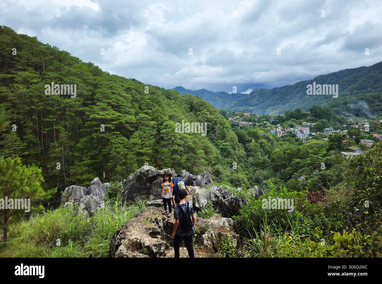 Tourist standing on a cliff in Sagada, Mountain Province, Philippines. - Smartphone Captured Stock Image