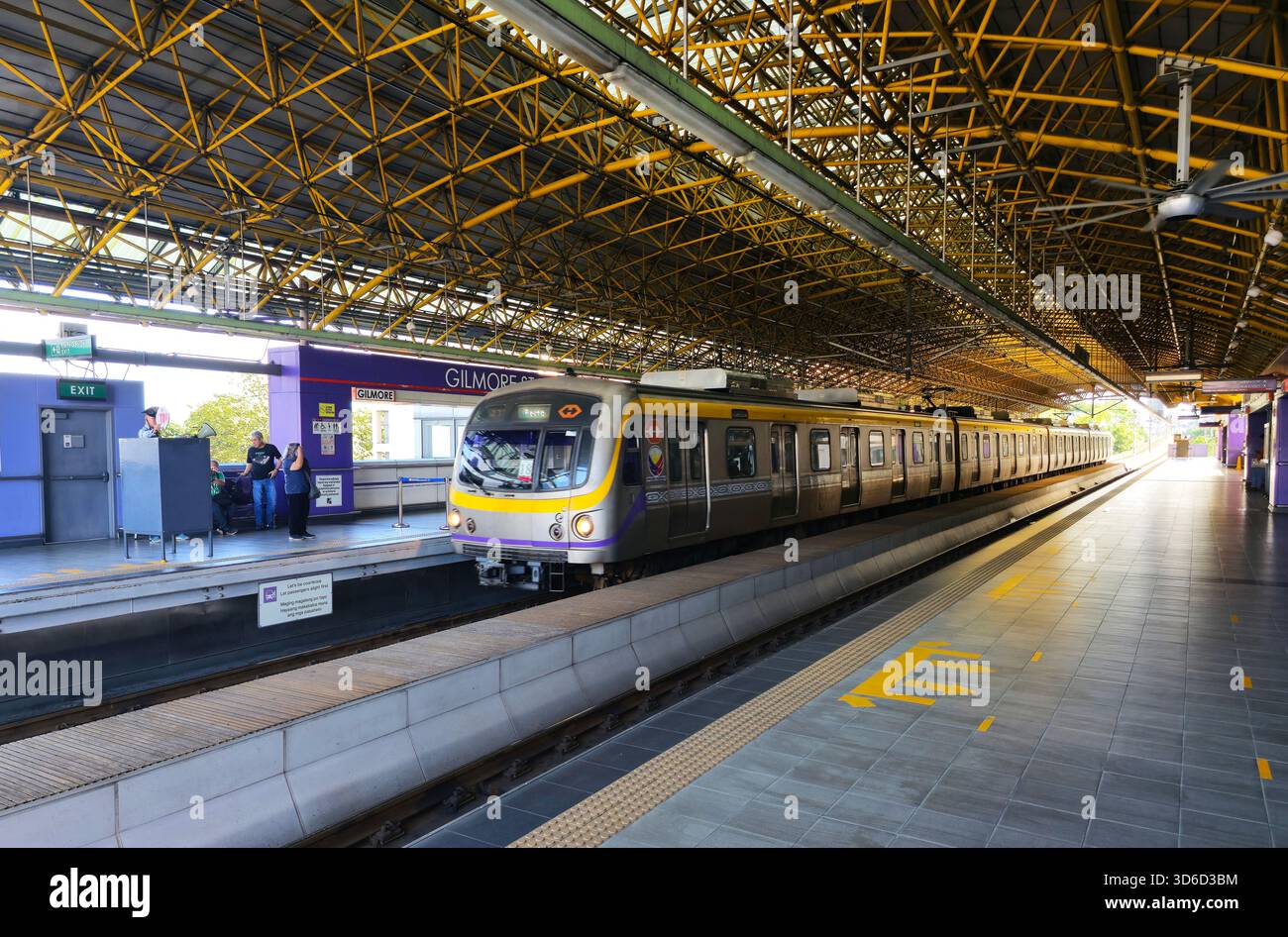 Train approaching Gilmor station in Quezon City, Metro Manila, Philippines. - Smartphone Captured Stock Image