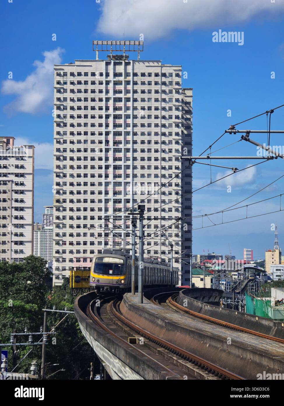 Train approaching Gilmor station in Quezon City, Metro Manila, Philippines. - Smartphone Captured Stock Image