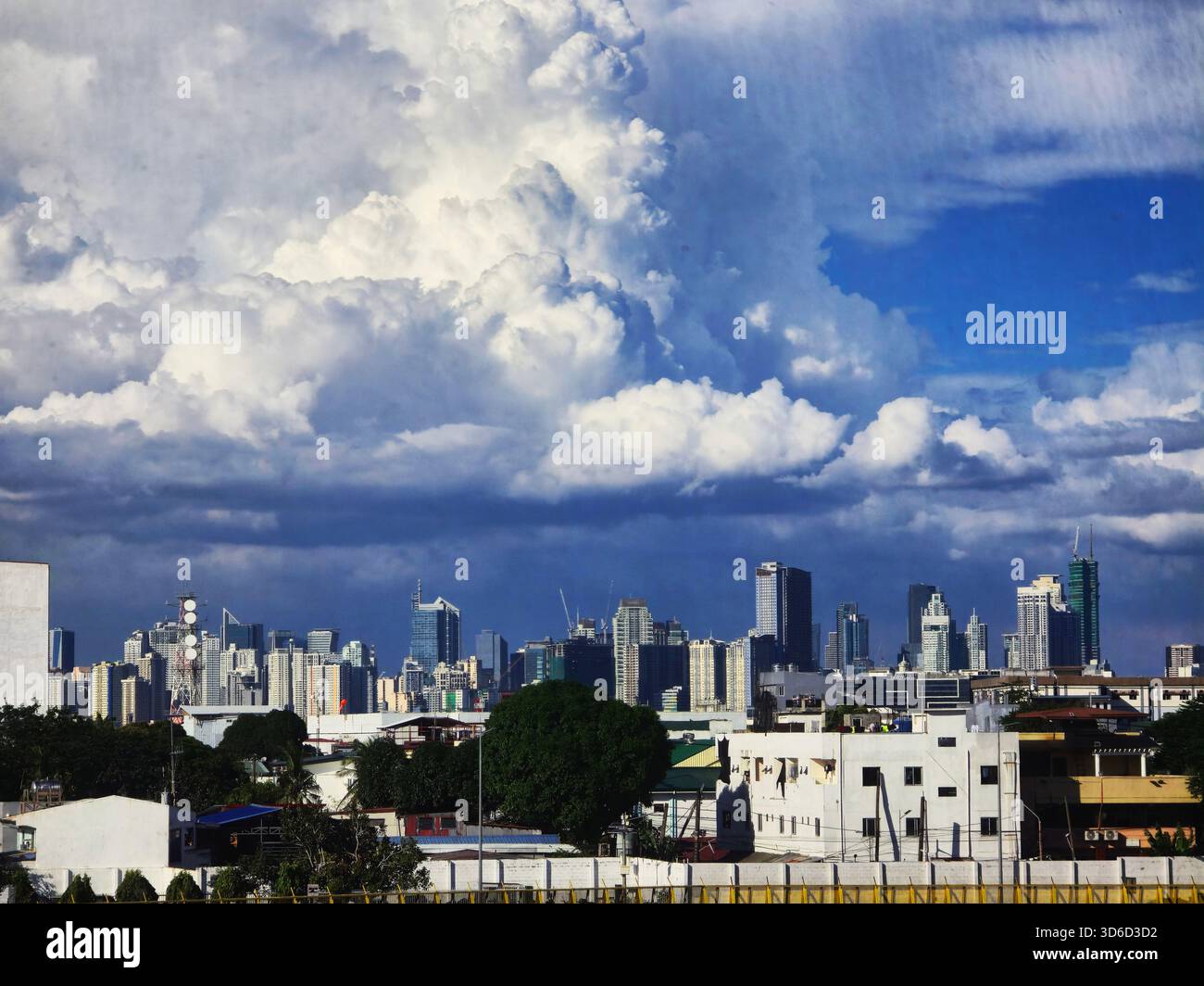 A menacing cloud over the modern skyline of Manila, Philippines. - Smartphone Captured Stock Image