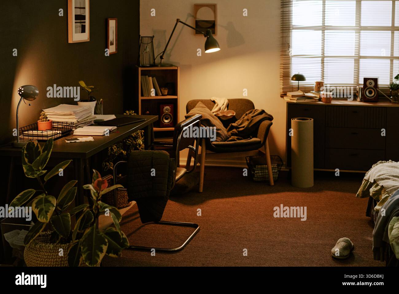 Cozy Room Interior with Cluttered Home Office Desk Stock Photo
