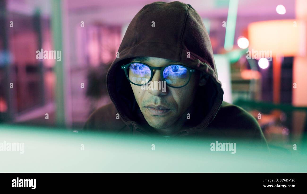 Night, hacking or man with computer for encryption breach, firewall attack or cybersecurity crisis. Confidential info, system access or it programmer Stock Photo