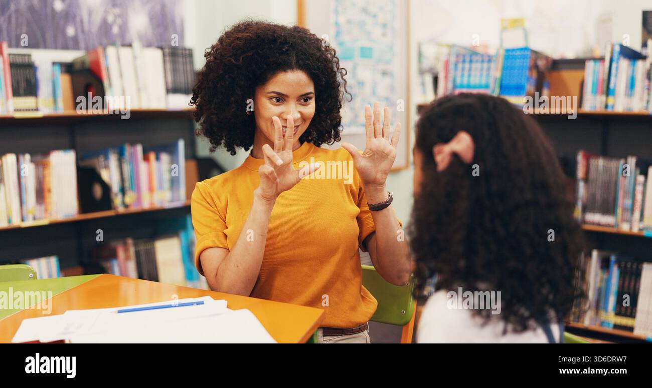 Teacher, child and lesson with counting in library with maths evaluation, numeracy and problem solving. Tutor, student and education with help for Stock Photo