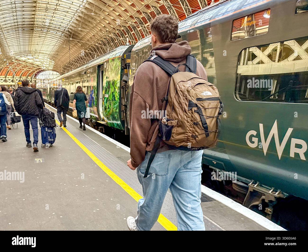 London, England, UK - 24 October 2025: People walking along a platform at London Paddington railway station after arriving on a high speed train - Smartphone Captured Stock Image