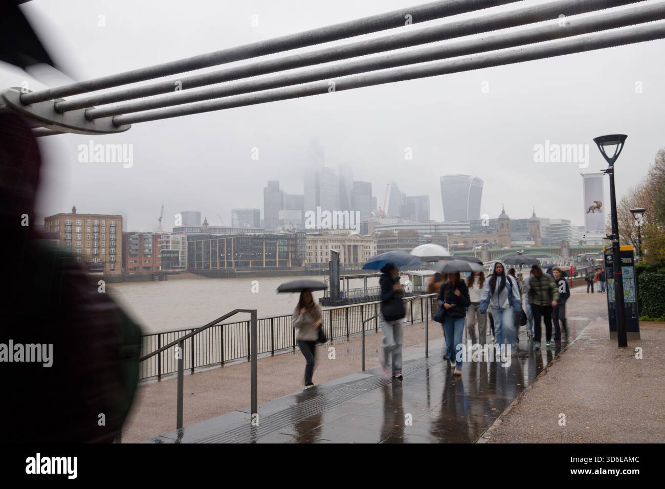 A rain soaked capital city of London on a wet day. Misty and rainy! The offices of the City of London in the background. Financial district Stock Photo