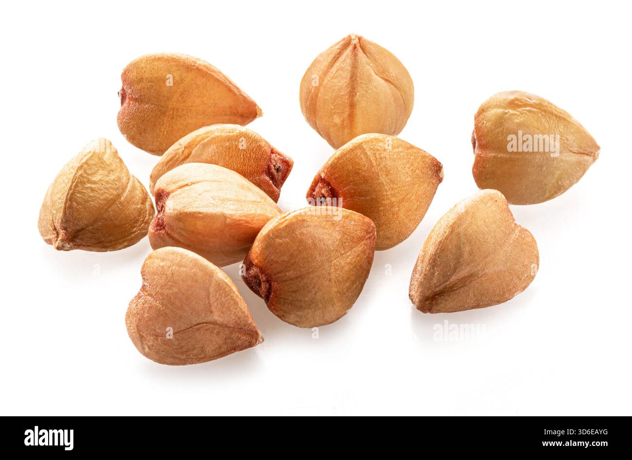Several buckwheat grains isolated on white background.  Macro. Stock Photo