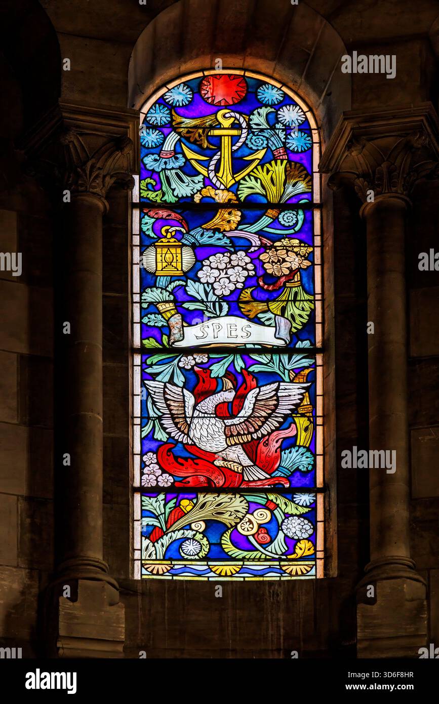 Stained glass window with phoenix, St Etienne (St Stephen) church, Briare, France Stock Photo