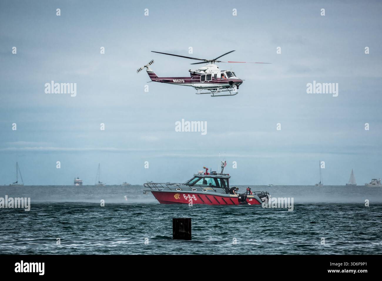 Helicopter and rescue boat performing a demonstration over Lake ...