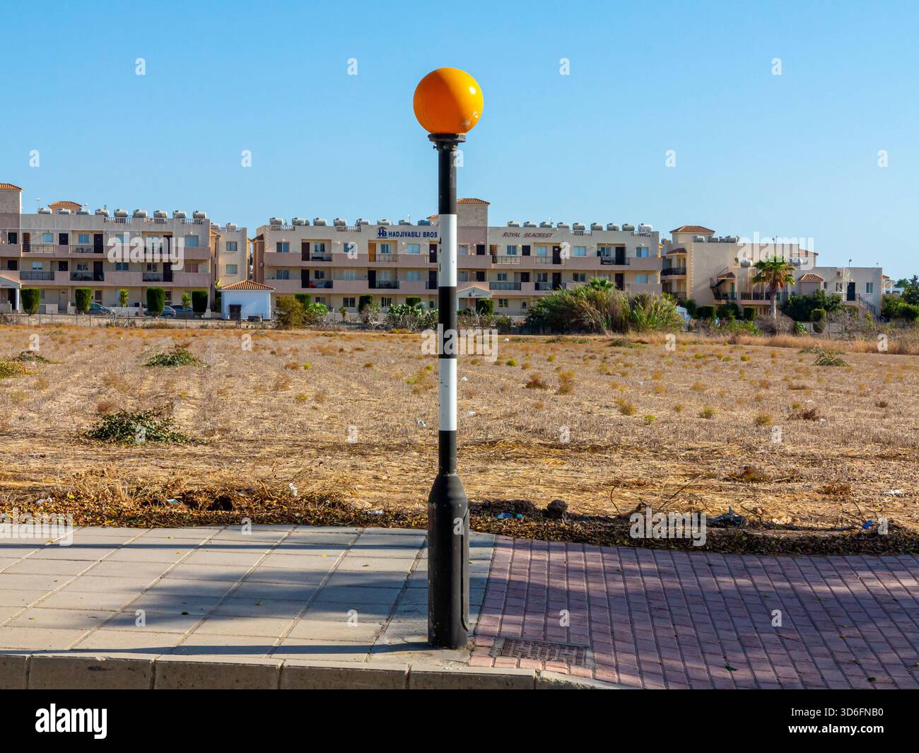British style Belisha Beacon at a pedestrian crossing in an empty ...