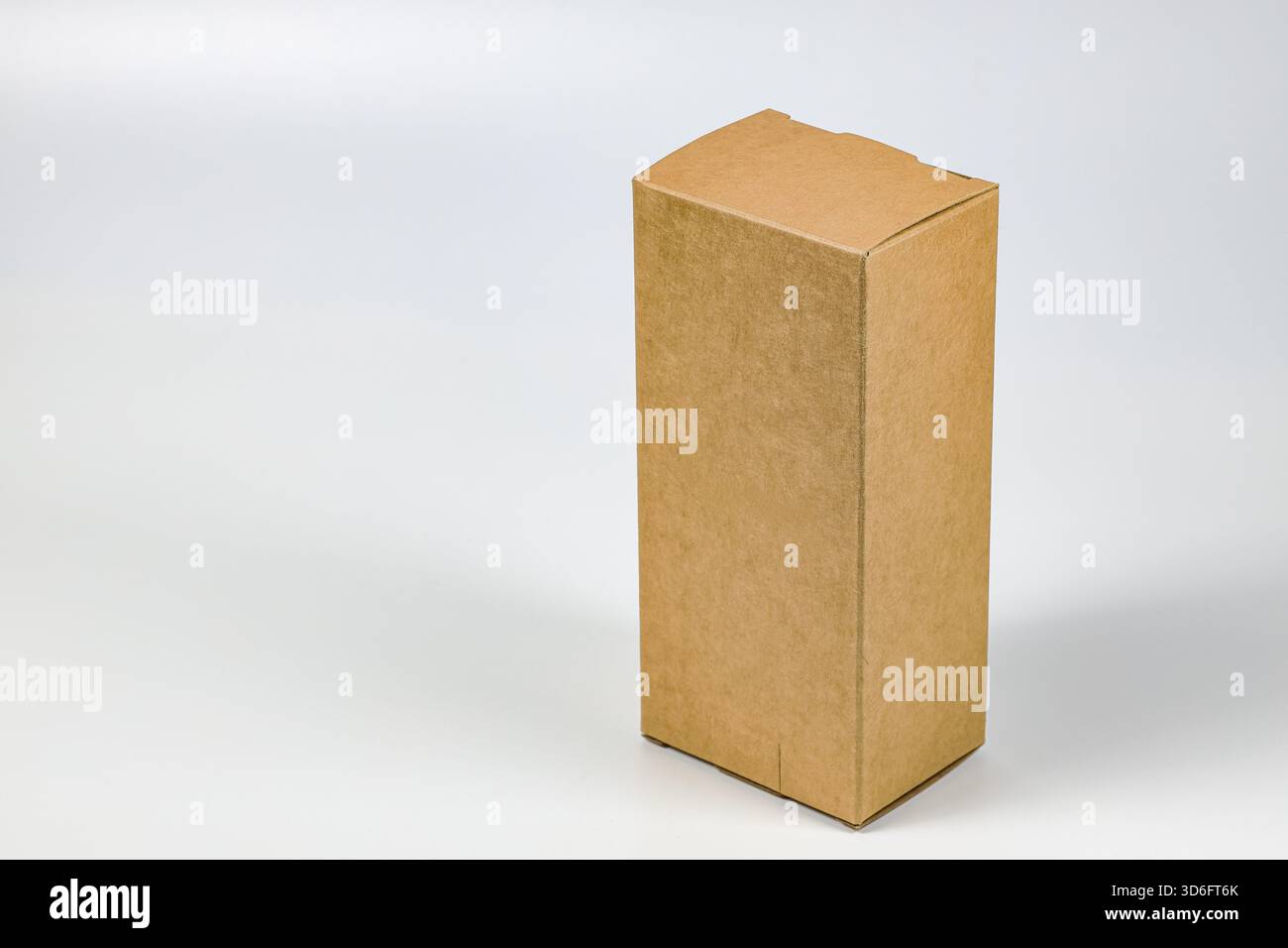 Rectangle Cardboard box for Parcel Delivery isolated on white background. Stock Photo