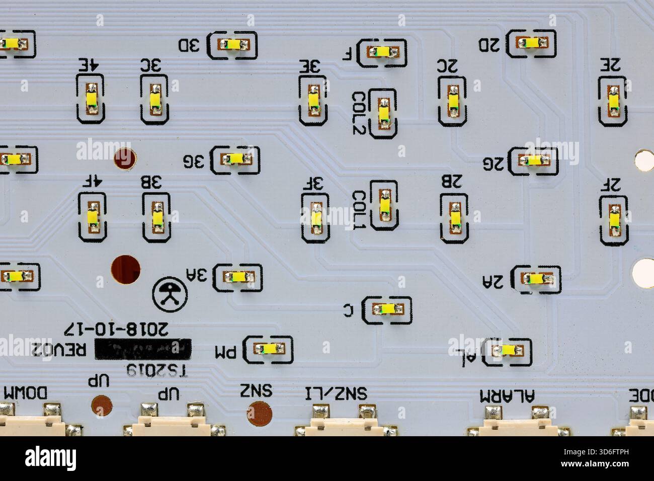 LED light module board, electronic circuit panel with surface mount diodes on gray PCB. Stock Photo