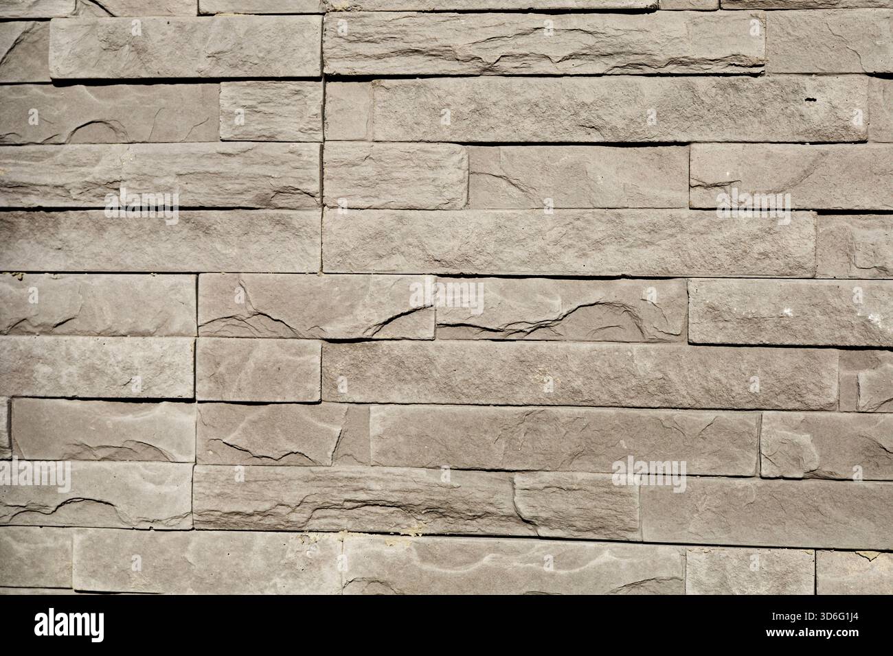 Stone wall texture with modern stacked tiles Stock Photo