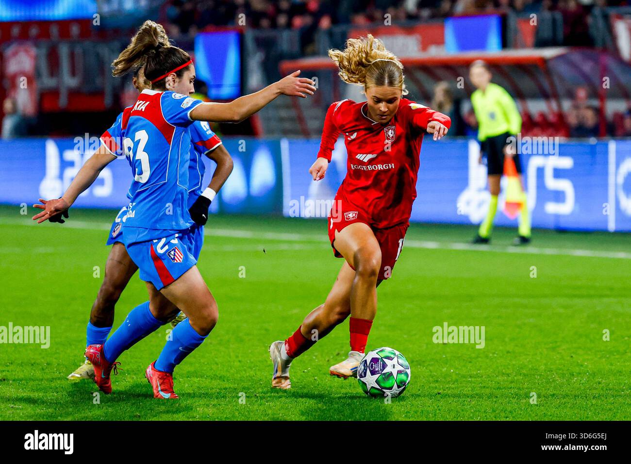 Sophie Proost of FC Twente dribbles with the ball under pressure from ...