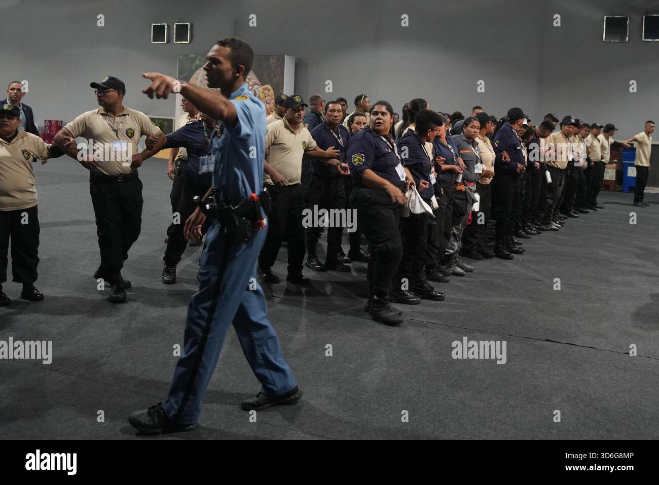 Security form a chain inside the venue for the COP30 U.N. Climate ...