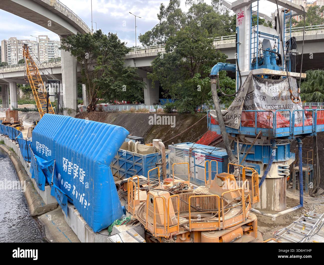 Construction site in Hong Kong featuring a large drilling rig ...