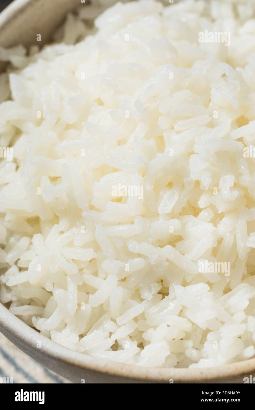 Organic Cooked Short Grain White Rice in a Bowl with Chipsticks Stock ...