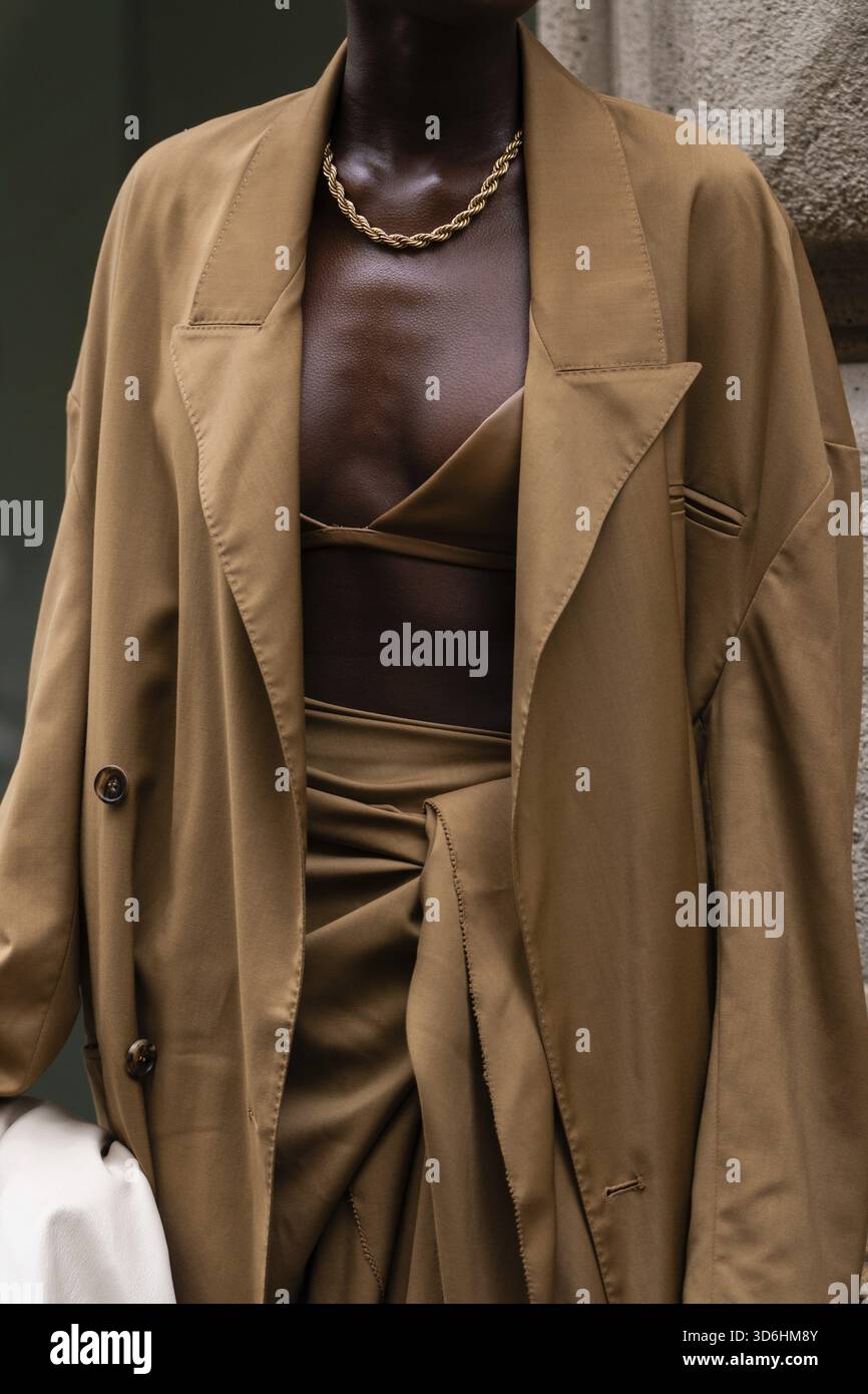 Female wearing beige top hi-res stock photography and images - Alamy