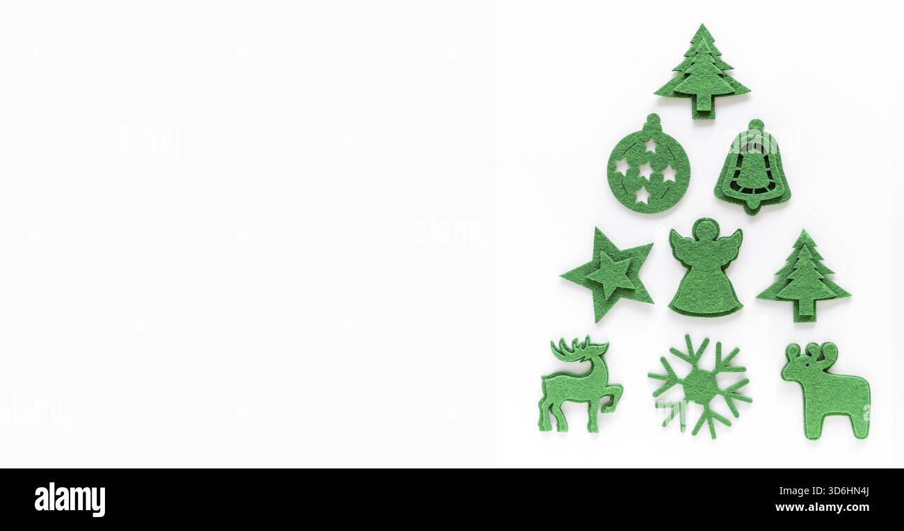 Creative christmas tree layout made from felt decorations. Flat lay, top view, copy space. Holiday festive minimal concept Stock Photo
