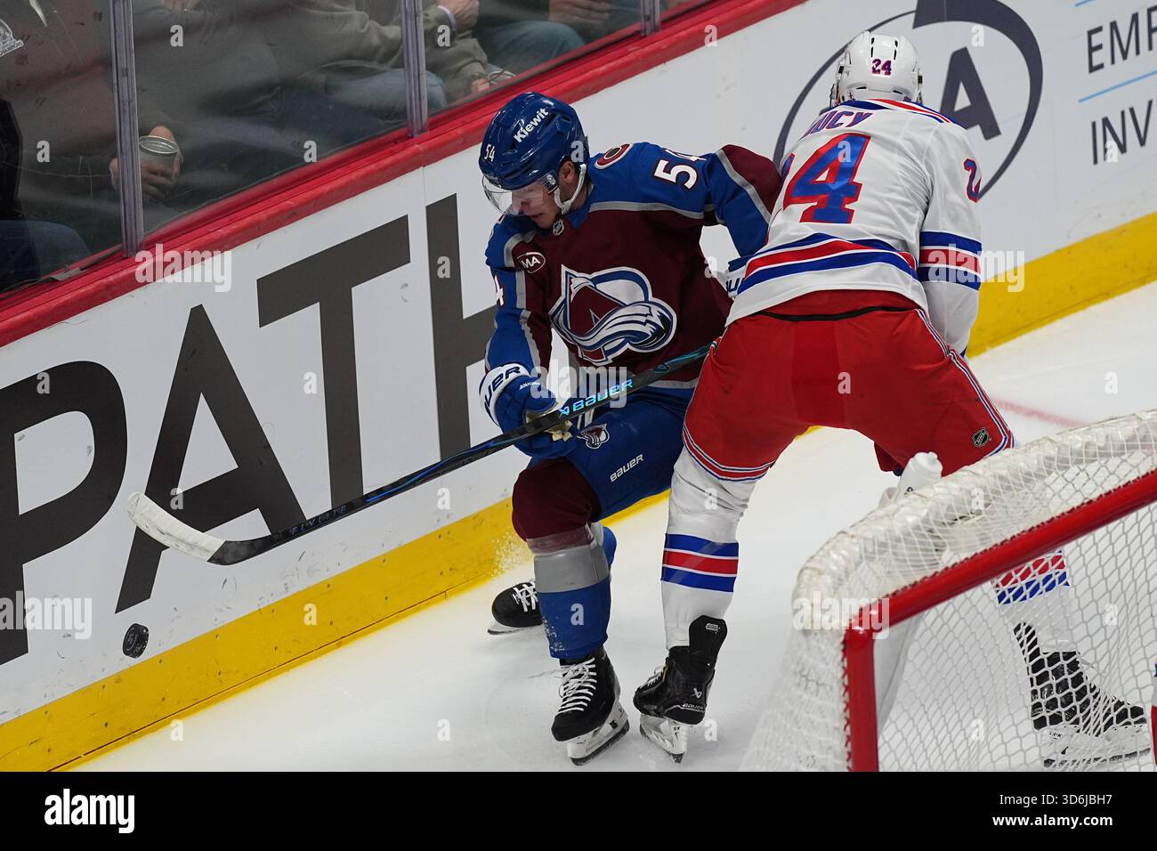 New York Rangers defenseman Carson Soucy, right, ties up Colorado ...