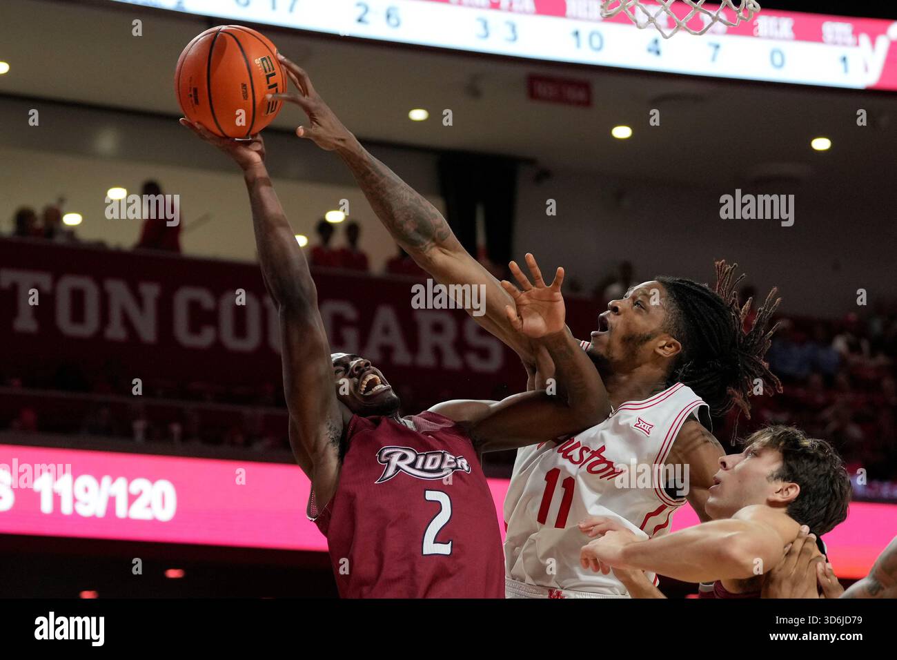 Caleb Rider Rider guard Caleb Smith (2) is blocked by Houston forward Joseph Tugler ...