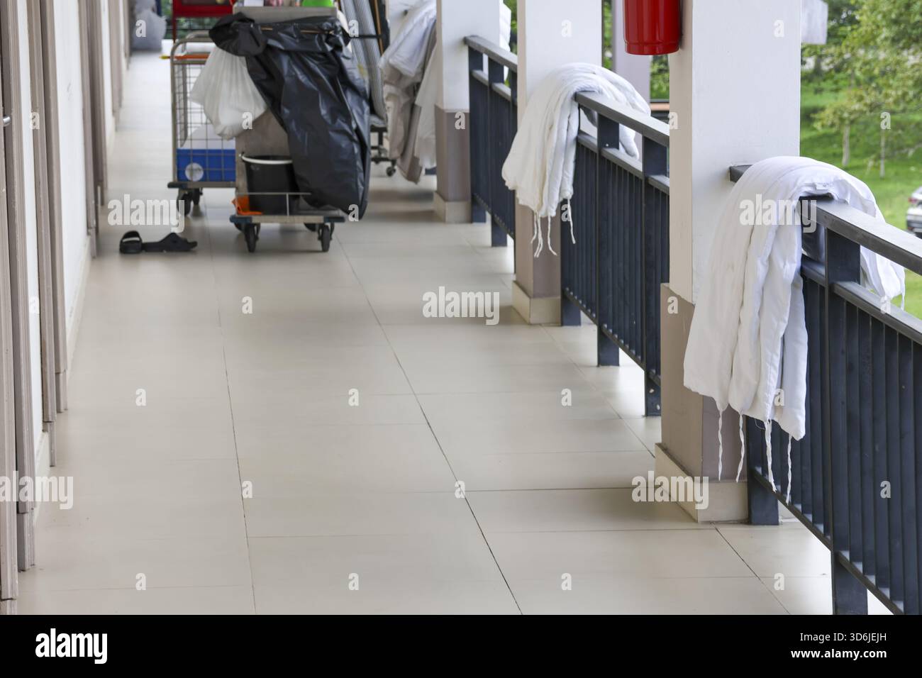 Housekeeping Pad Railing Routine day at hotel corridor with housekeeping cart and fresh white ...