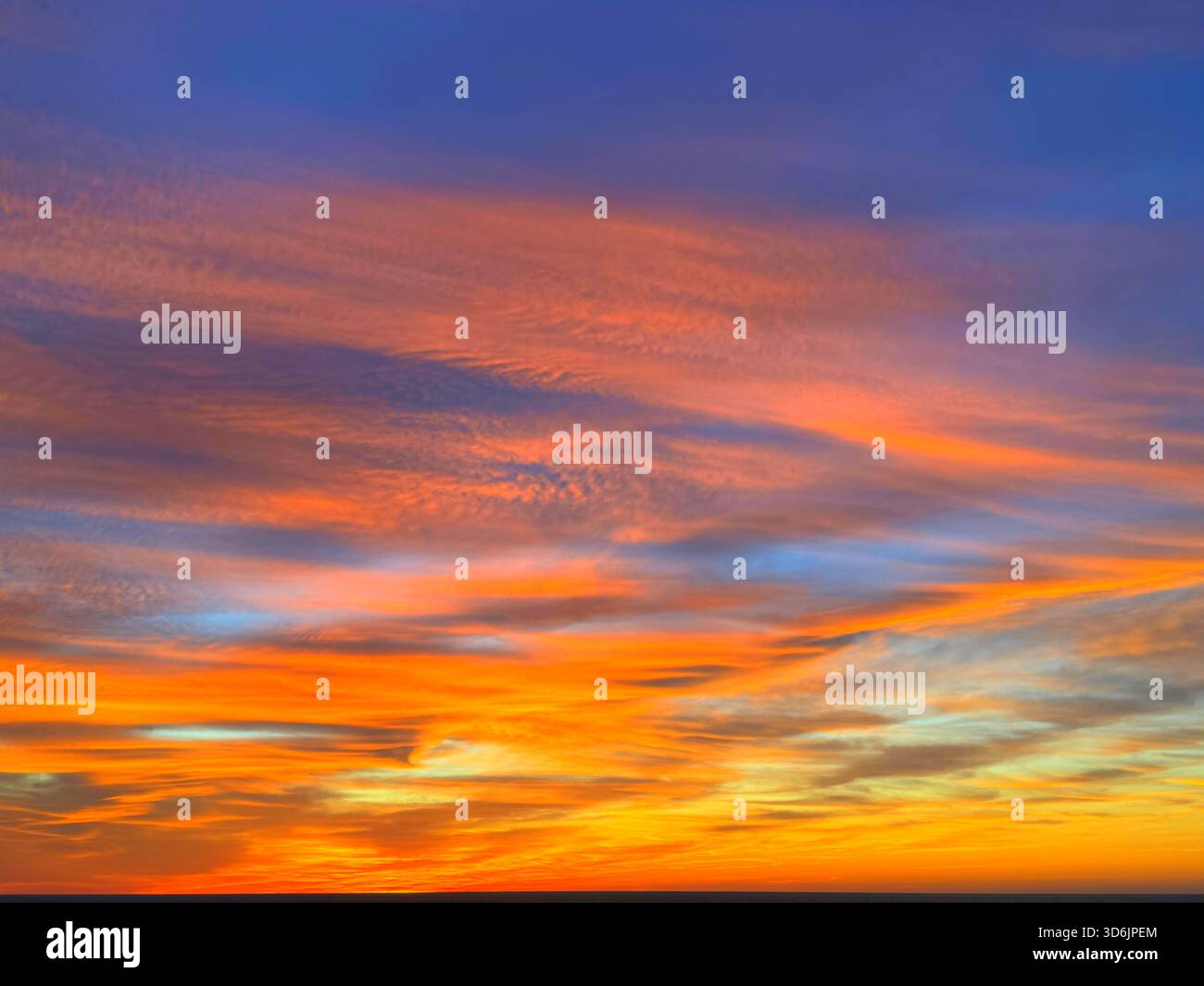 Fiery orange sunset sky clouds background Stock Photo