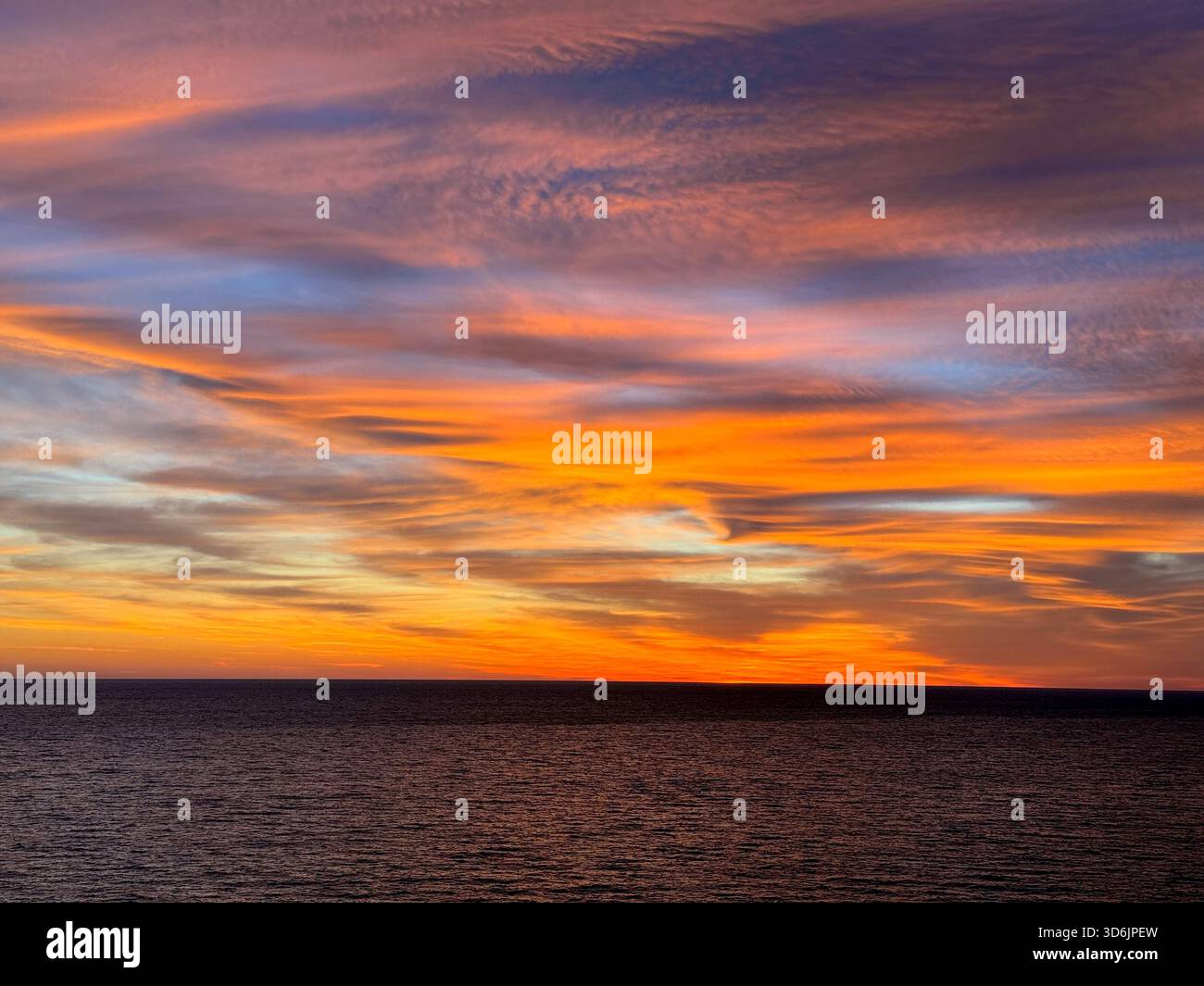 Sunset dramatic sky over sea Stock Photo