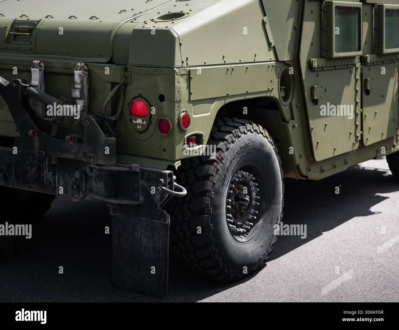 Close-up rear quarter view of a military Humvee truck. Olive drab green ...