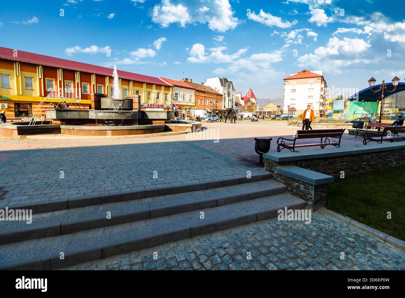 khust, ukraine - 06 nov 2015: old city downtown in autumn. fountain on the central square of independence on a sunny weather. travel destination of tr Stock Photo