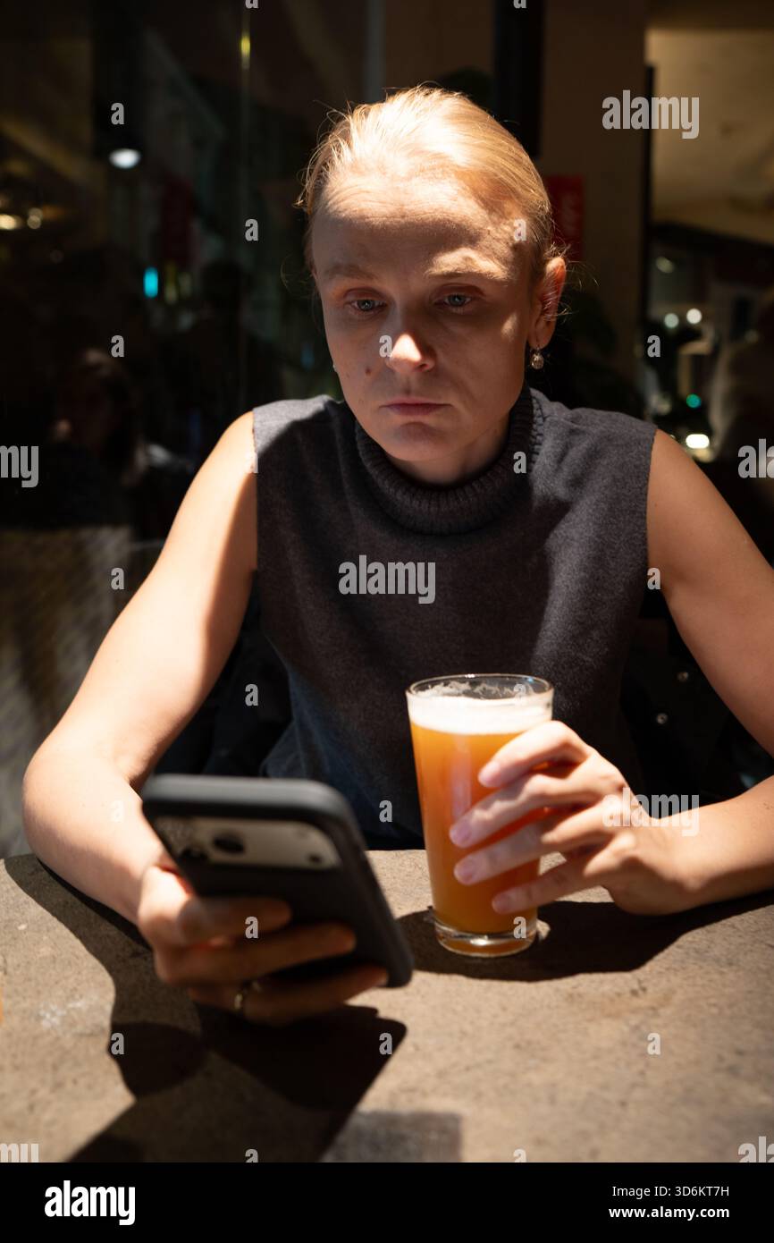 Woman using smartphone in dimly hi-res stock photography and images - Alamy