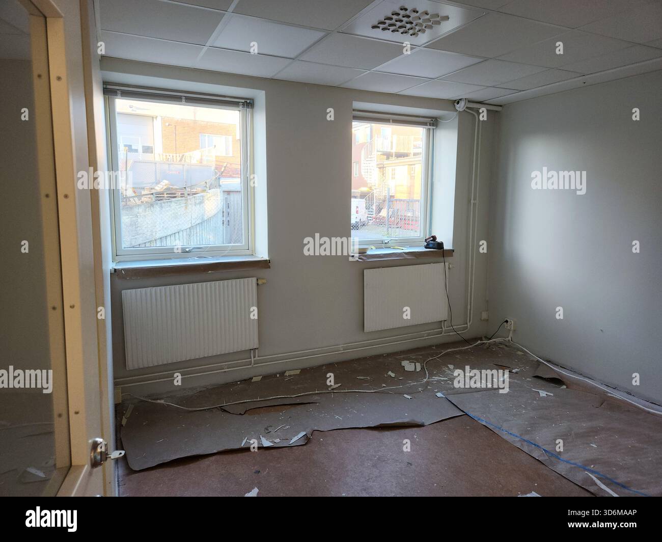 Picture of Close view of beige room during renovation with floor covered by ...