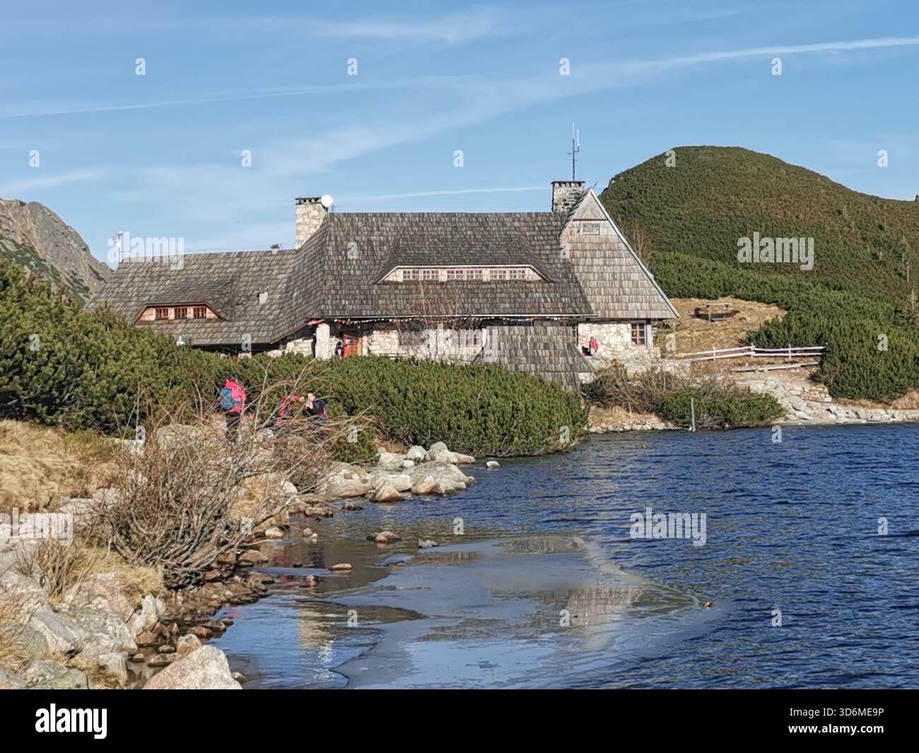 Schronisko Pięciu Stawów, Tatra Mountains—Poland’s highest hut on Przedni Staw lake amid snow‑dusted peaks in early winter. - Smartphone Captured Stock Image