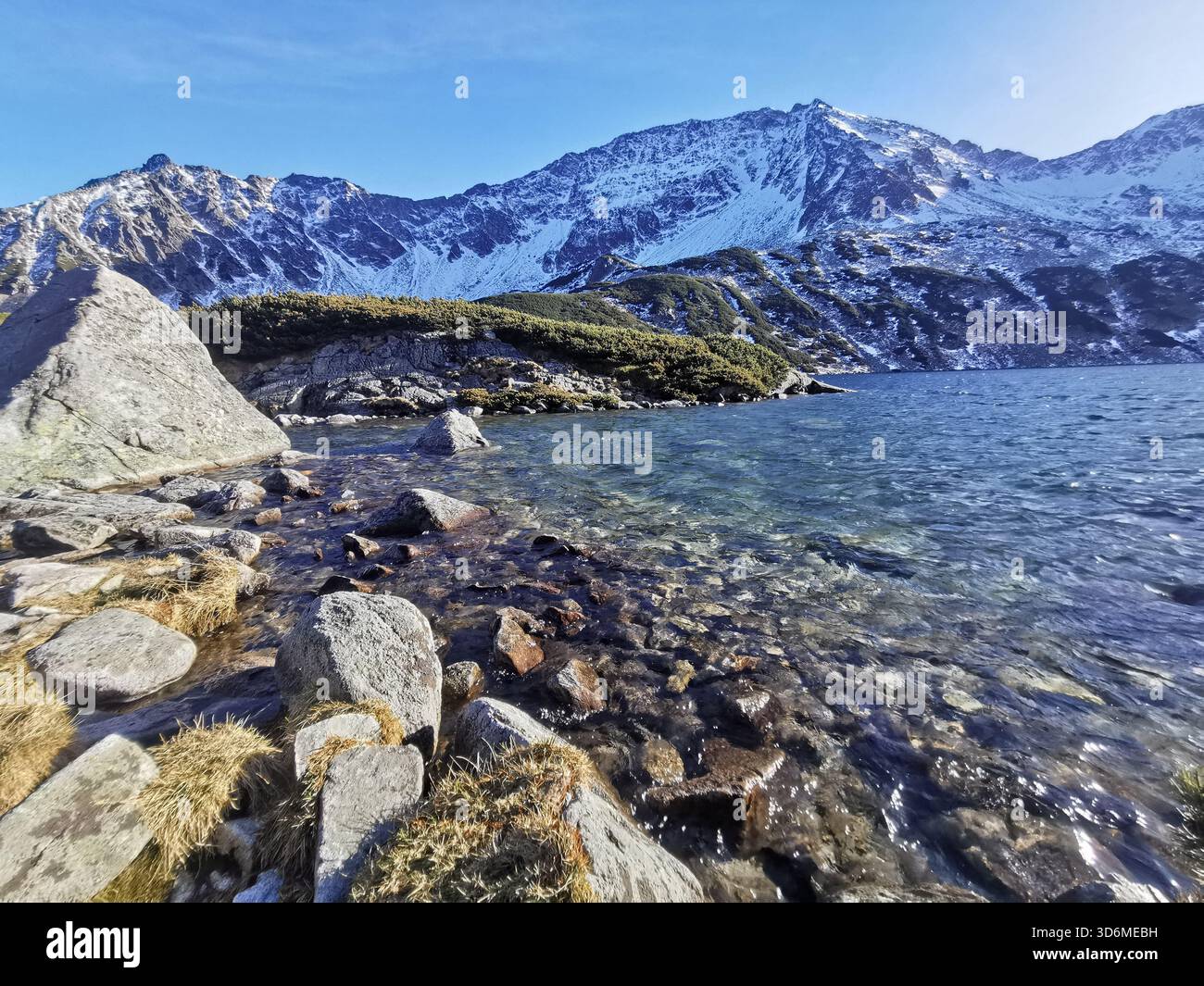 Wielki Staw in Dolina Pięciu Stawów Polskich (5 Polish Ponds Valley, Tatra Mountains, early winter lake with snow‑dusted peaks, Poland travel nature. - Smartphone Captured Stock Image