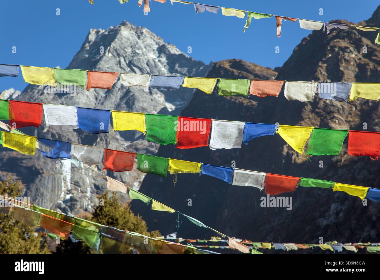 Prayer flags with himalayas mountains in the background, Nepali and Tibetan buddhism Stock Photo